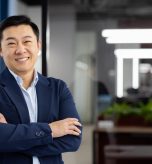Portrait of successful asian businessman inside office at workplace, man in business suit smiling looking at camera, mature boss with crossed arms, successful financier broker.