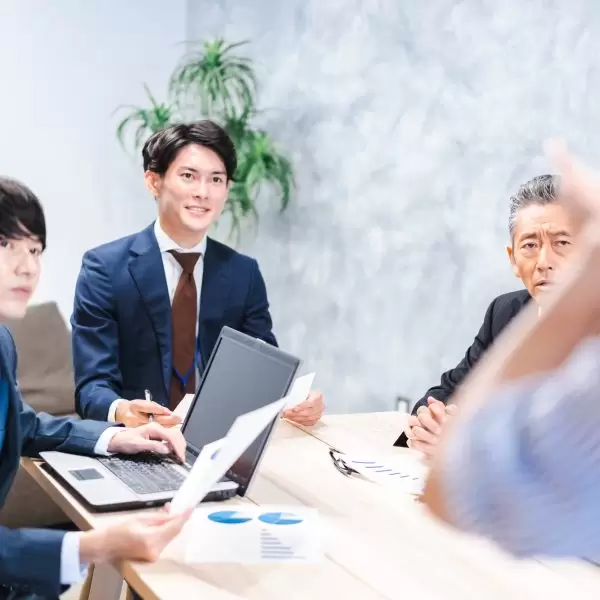 Business people listening to a presentation on product planning