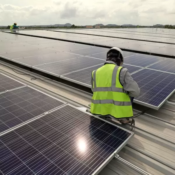 Technician Connecting Cable Solar Rooftop